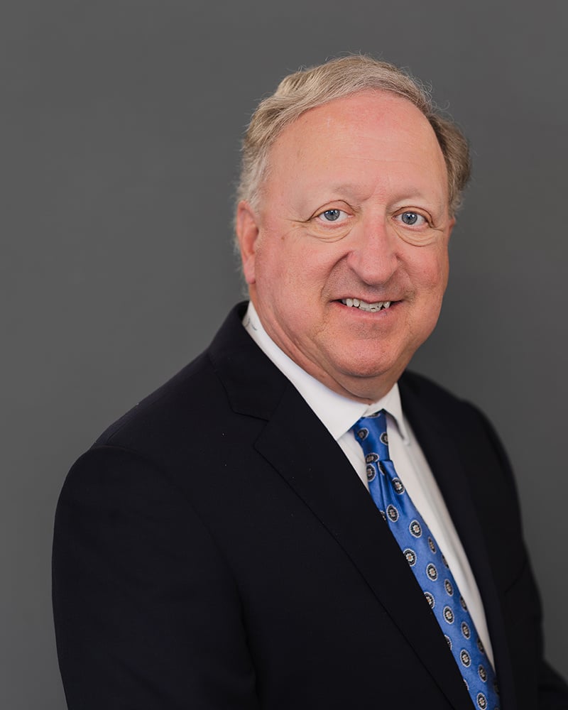 profile headshot of Mark E. Roth